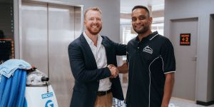 Urban Clean cleaner and client shaking hands.